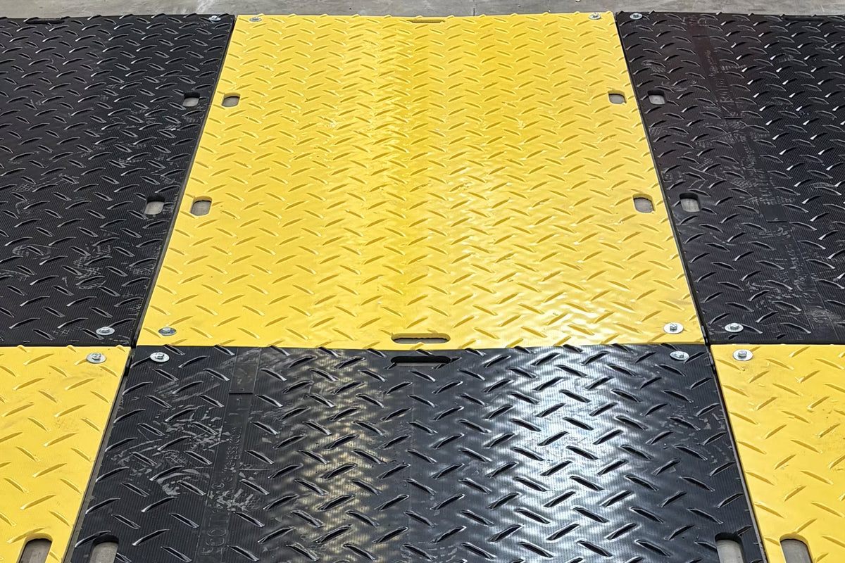 Ground protection mats joined at the corners with bolted connectors