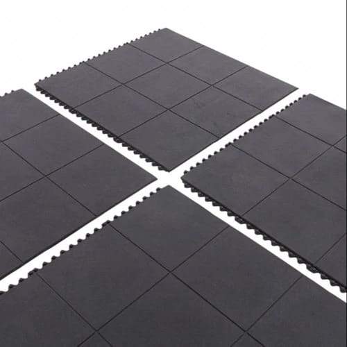 Four black 3ft x 3ft interlocking rubber tiles laid out ready to join